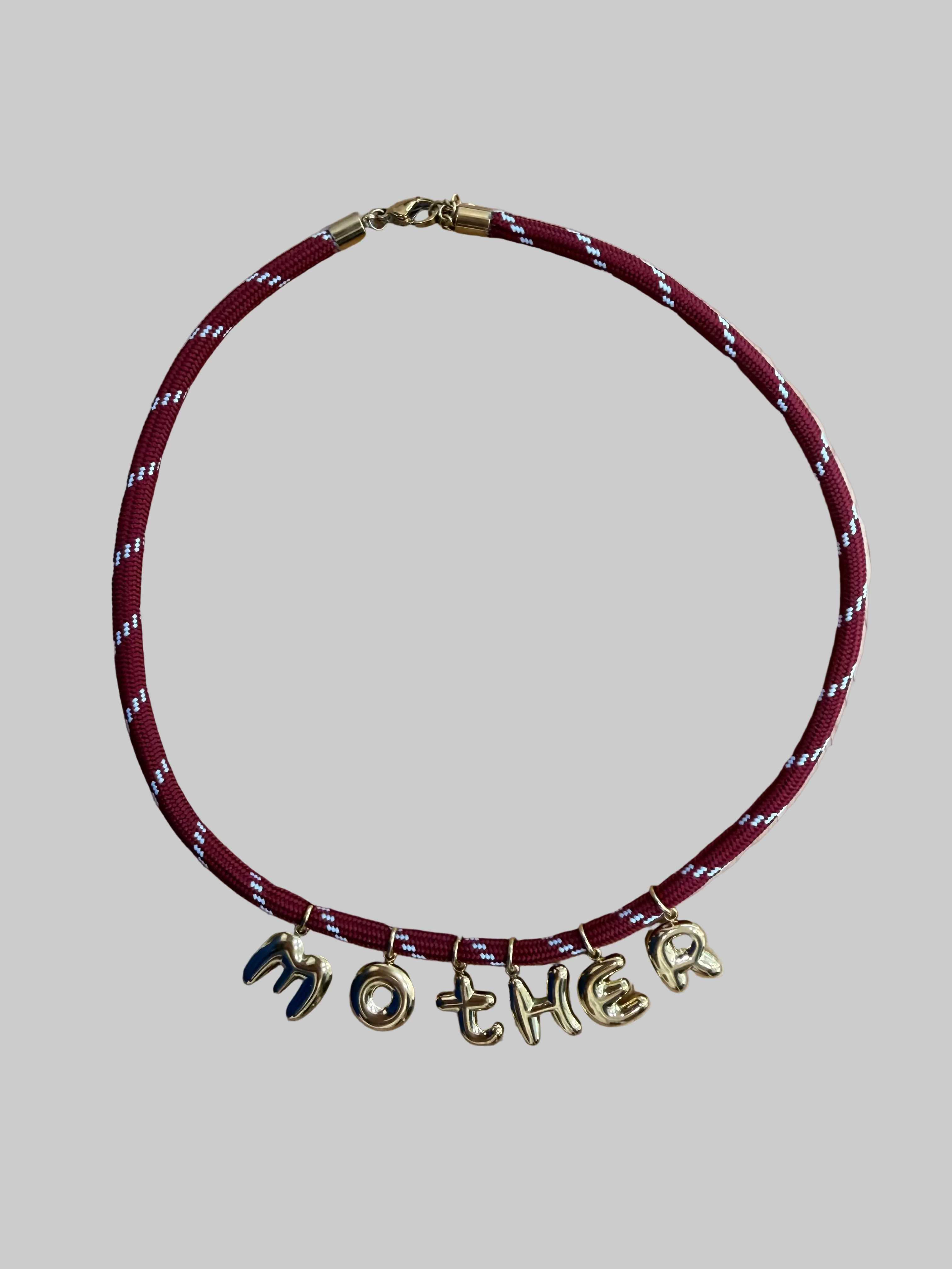 Necklace with 'MOTHER' charms 