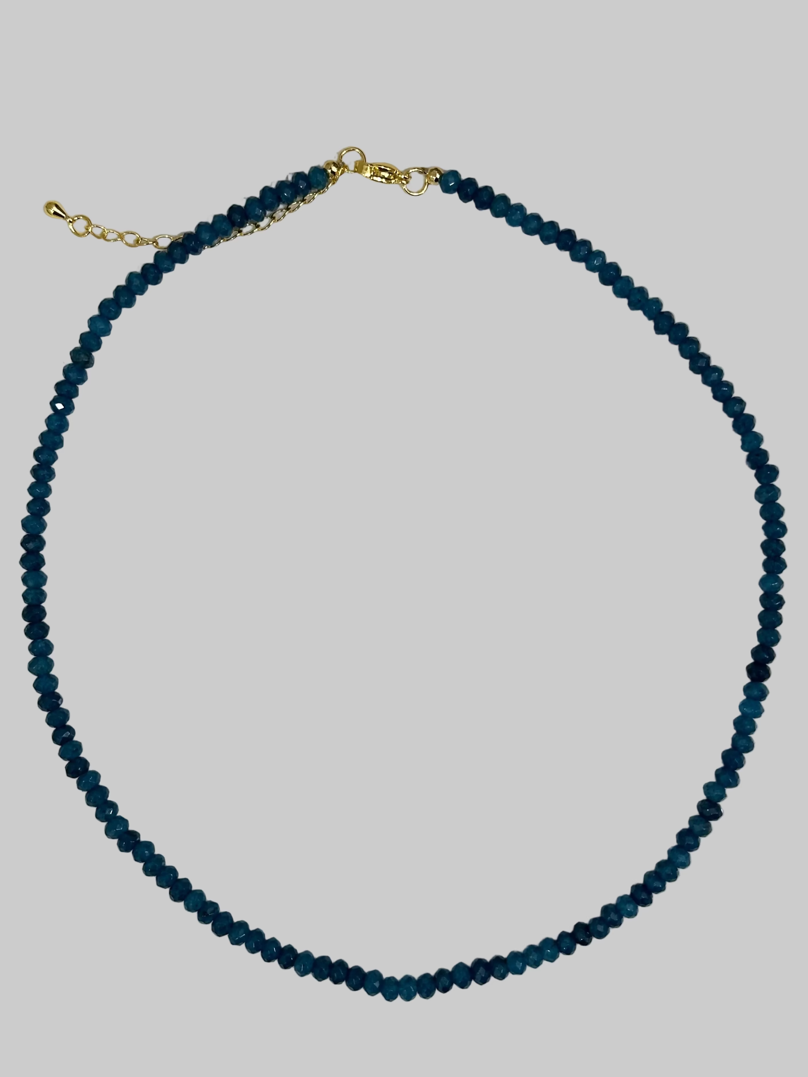 Blue beaded necklace with a gold clasp