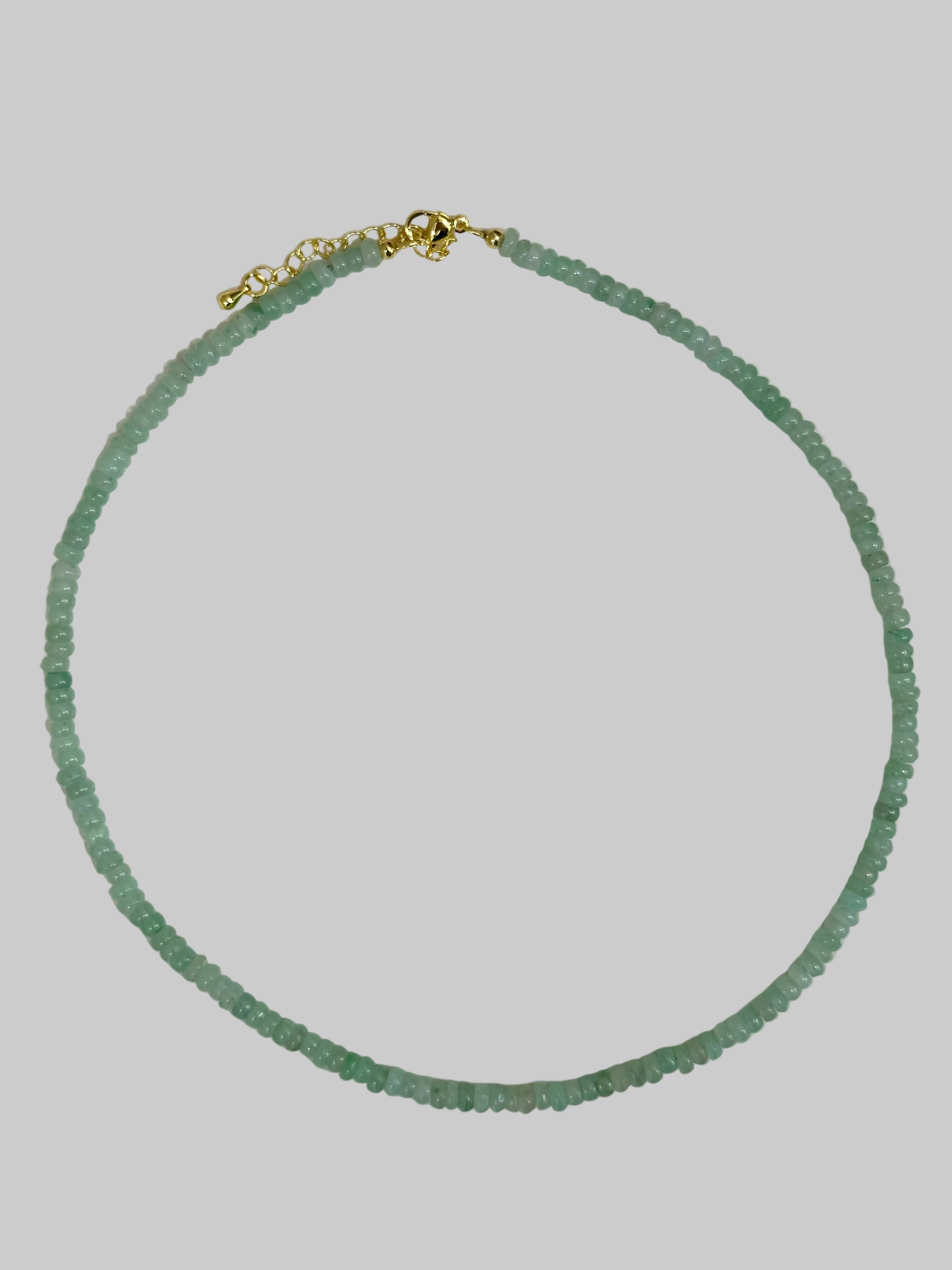 Green beaded necklace with a gold clasp