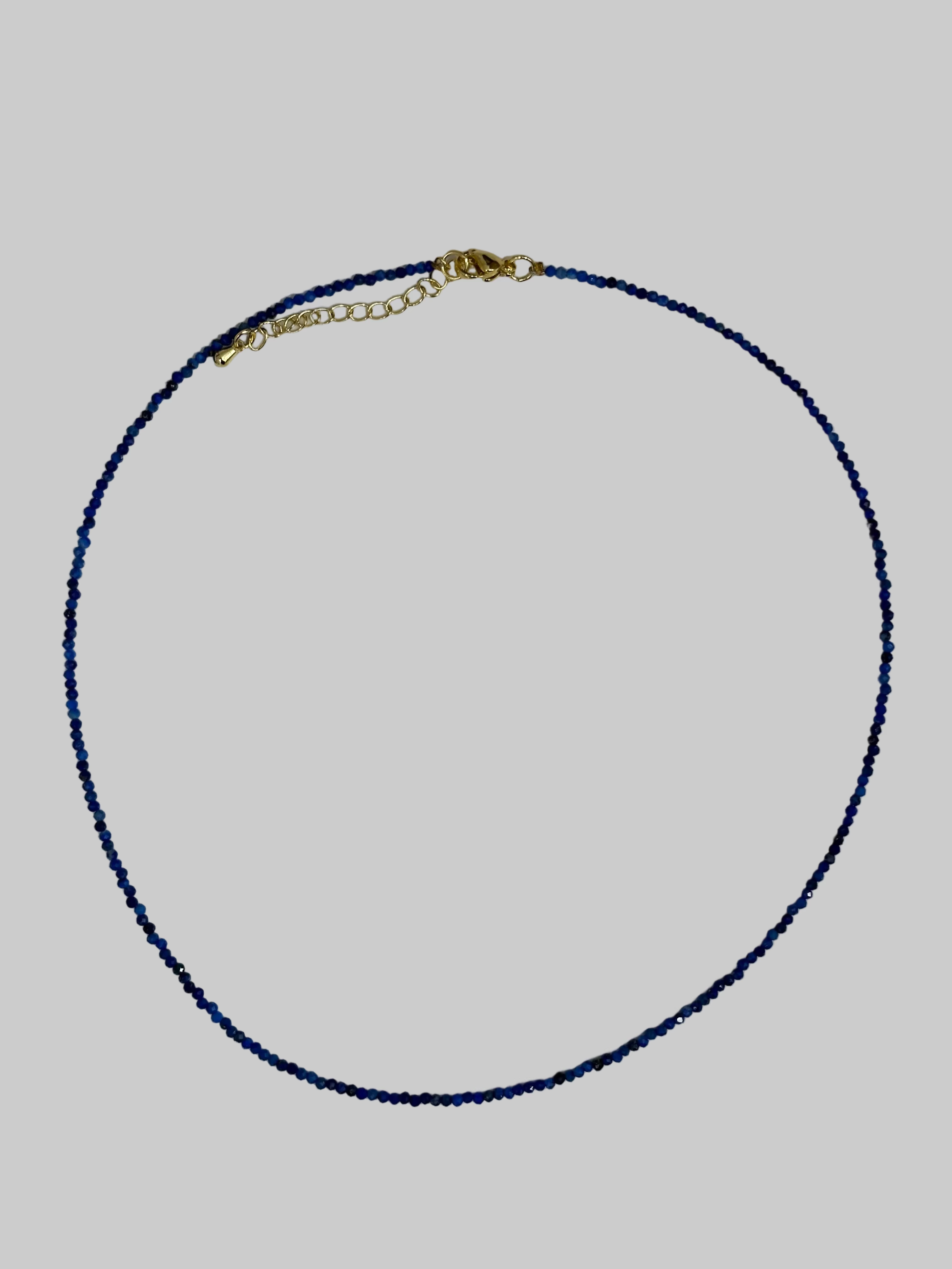 Gold chain with blue beads